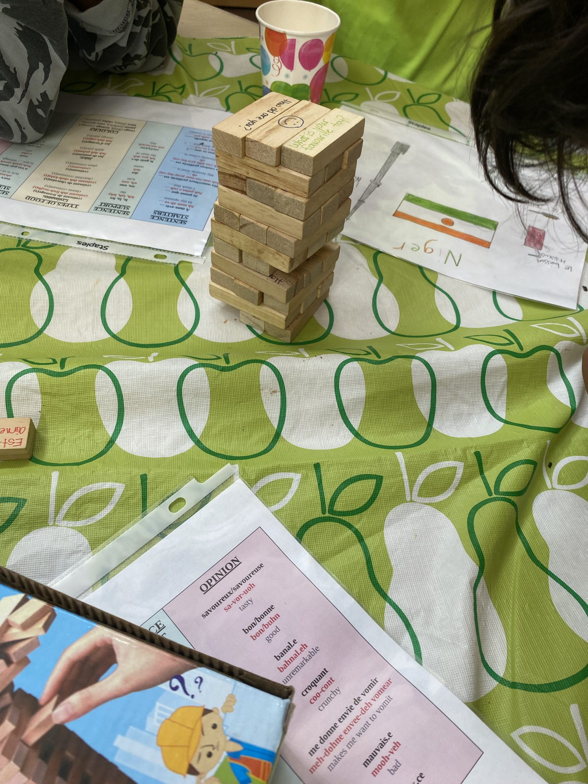 Various games on a table with a table cloth